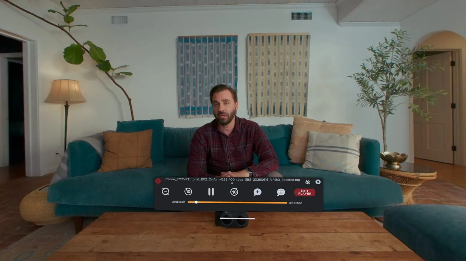 The Screening Room transport over a 180° tutorial shot of a man on a living-room sofa, with skip, pause, add-comment and comment-list controls.