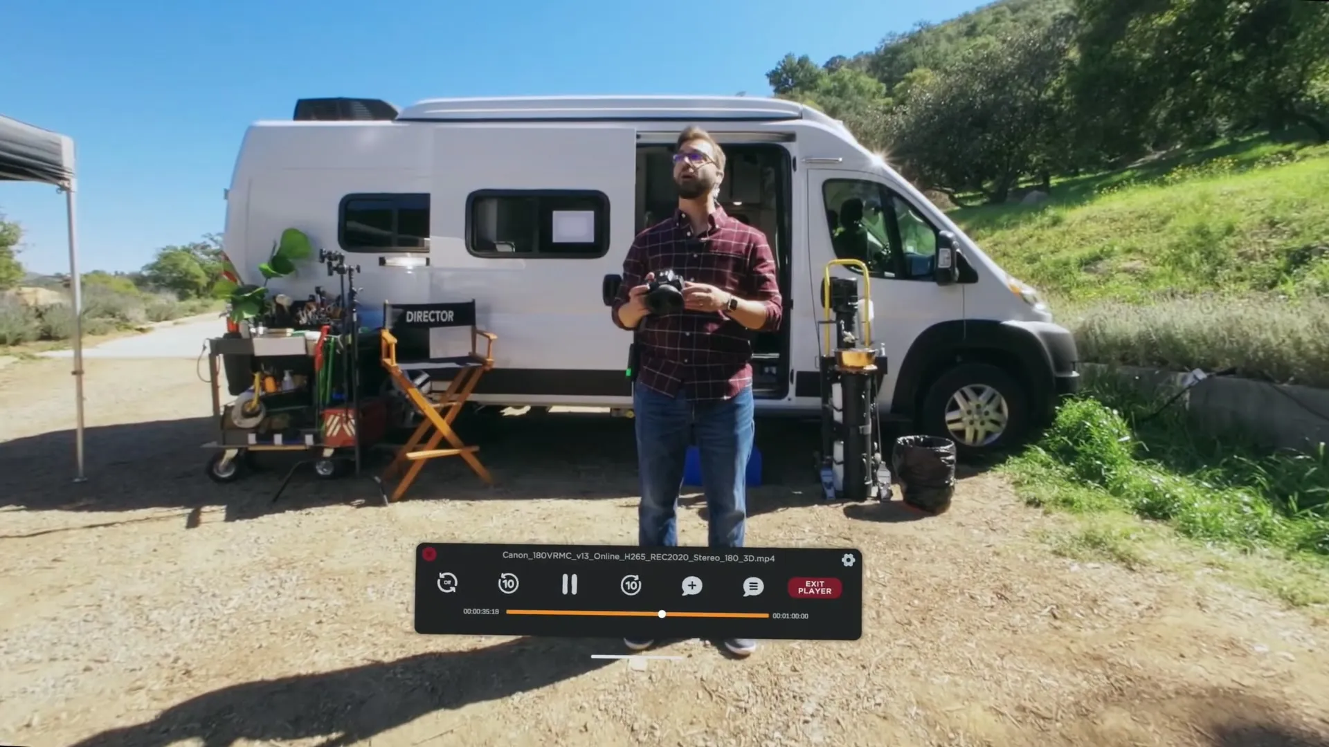 Screening Room in the headset playing a 180° stereo clip of a man holding a camera beside a production van, with the transport bar and timecode below.
